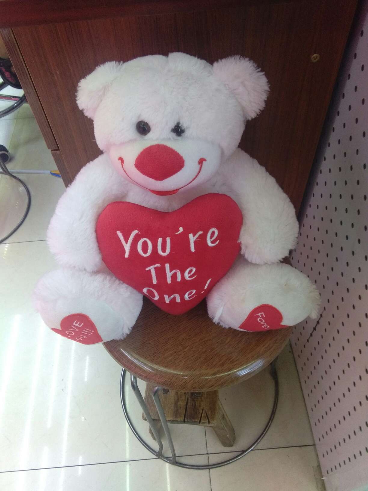 A white heart-hugging bear on Valentine's Day