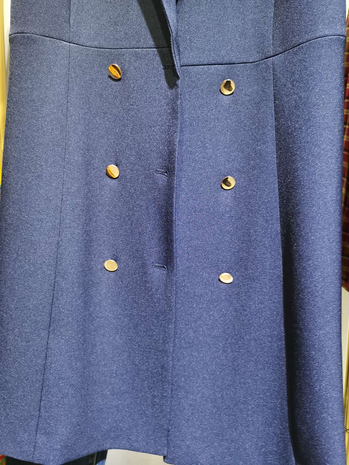 A large suit with a lapel, double-breasted and long waistcoat details Picture