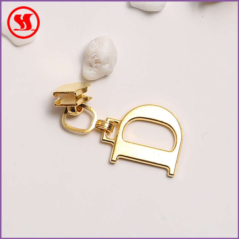 No. 5 metal gold plated puller for clothing accessories shall be issued on the same day