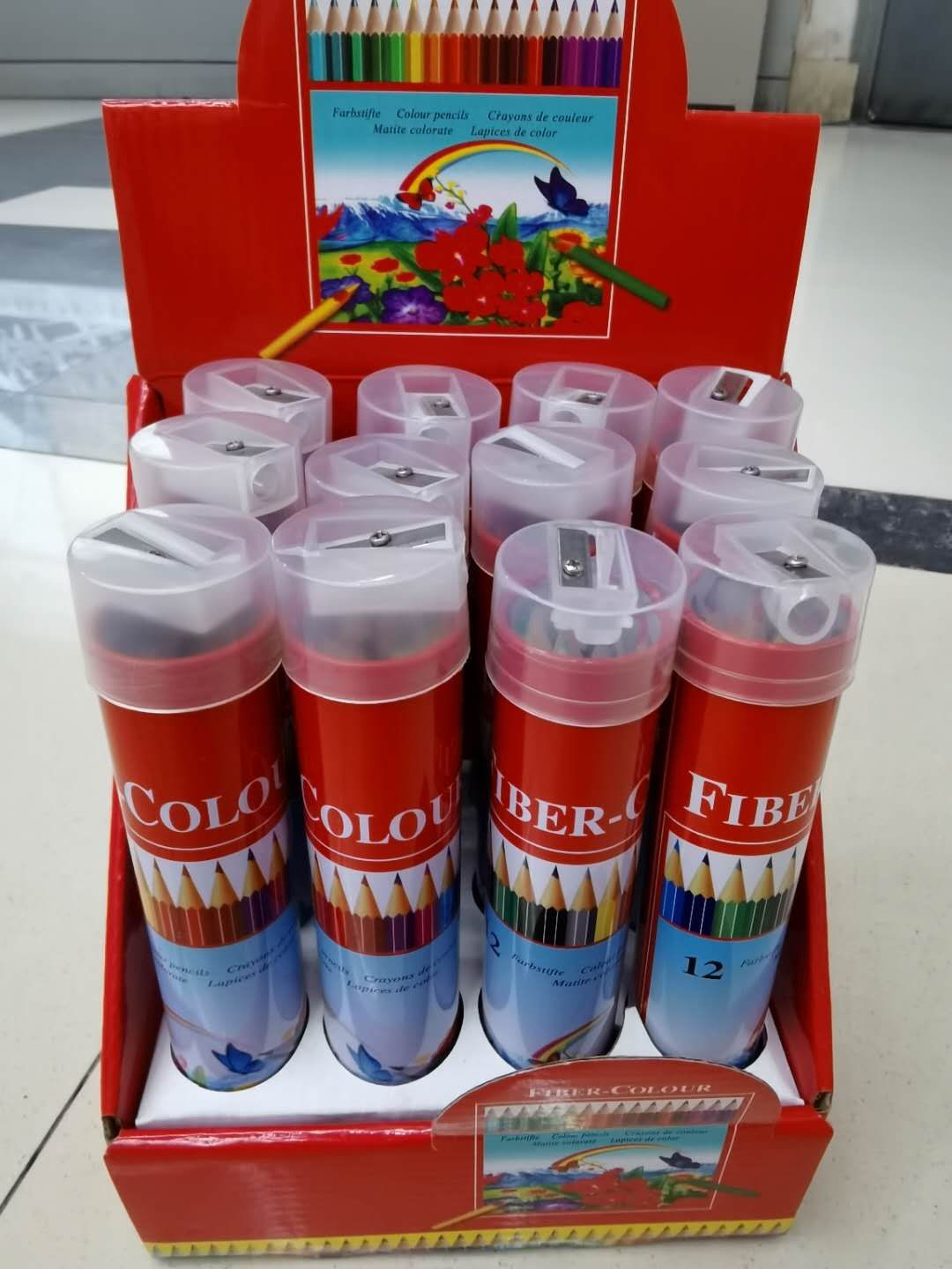 Colored pencils in iron drums