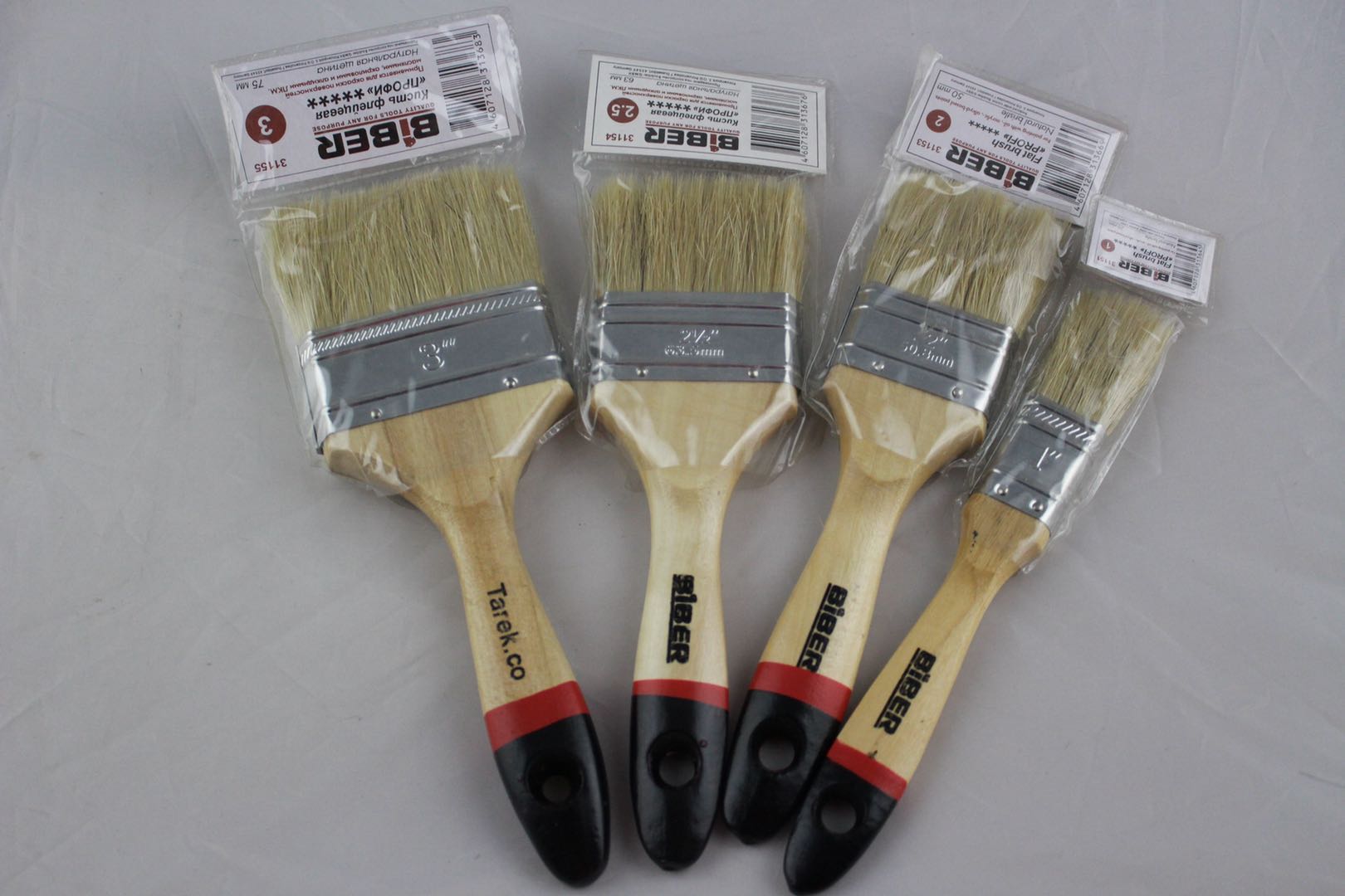 Two-inch wooden-handled paint brush