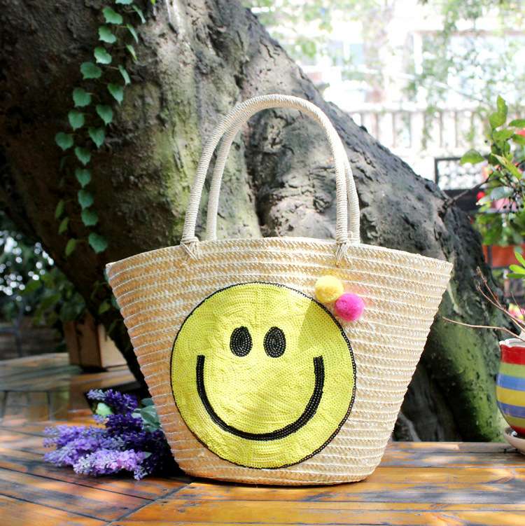 厂价新款笑脸卡通草编包流苏球球沙滩包时尚编织包女包图