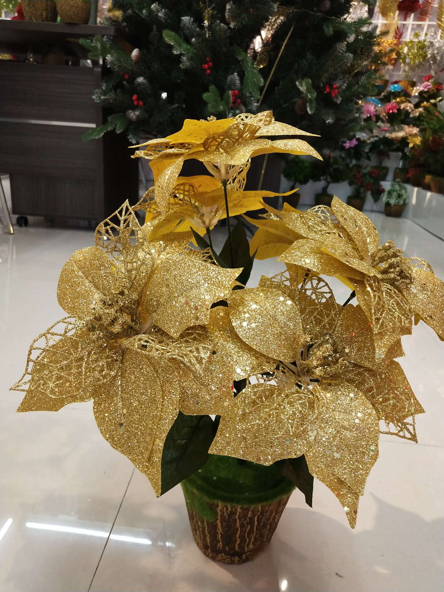 Seven gold pink sequined Christmas flowers