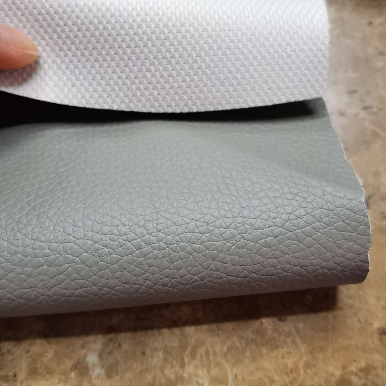 Factory direct sales: fishnet fabric base, small litchi pattern pvc sofa leather, car interior leather Specification image