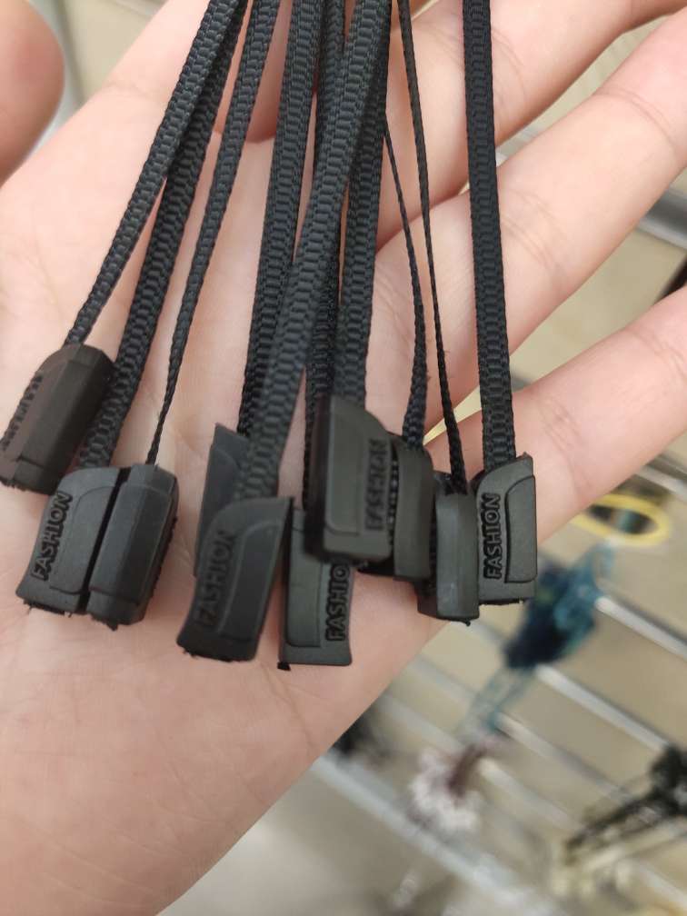 Close-up of banderole detailing on a designer handbag