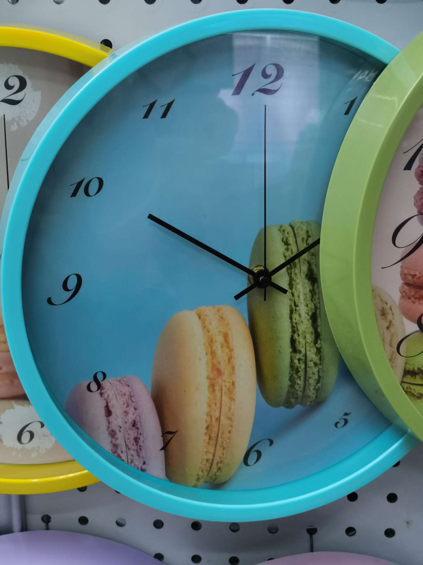 The wall clock is a blue macaron