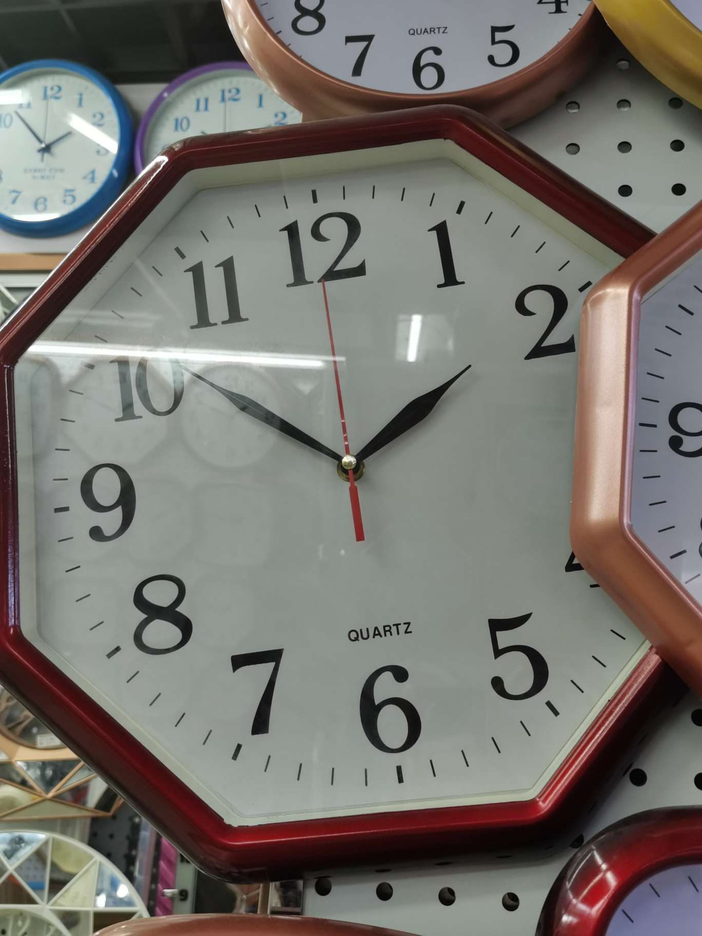 A red living room with a wall clock