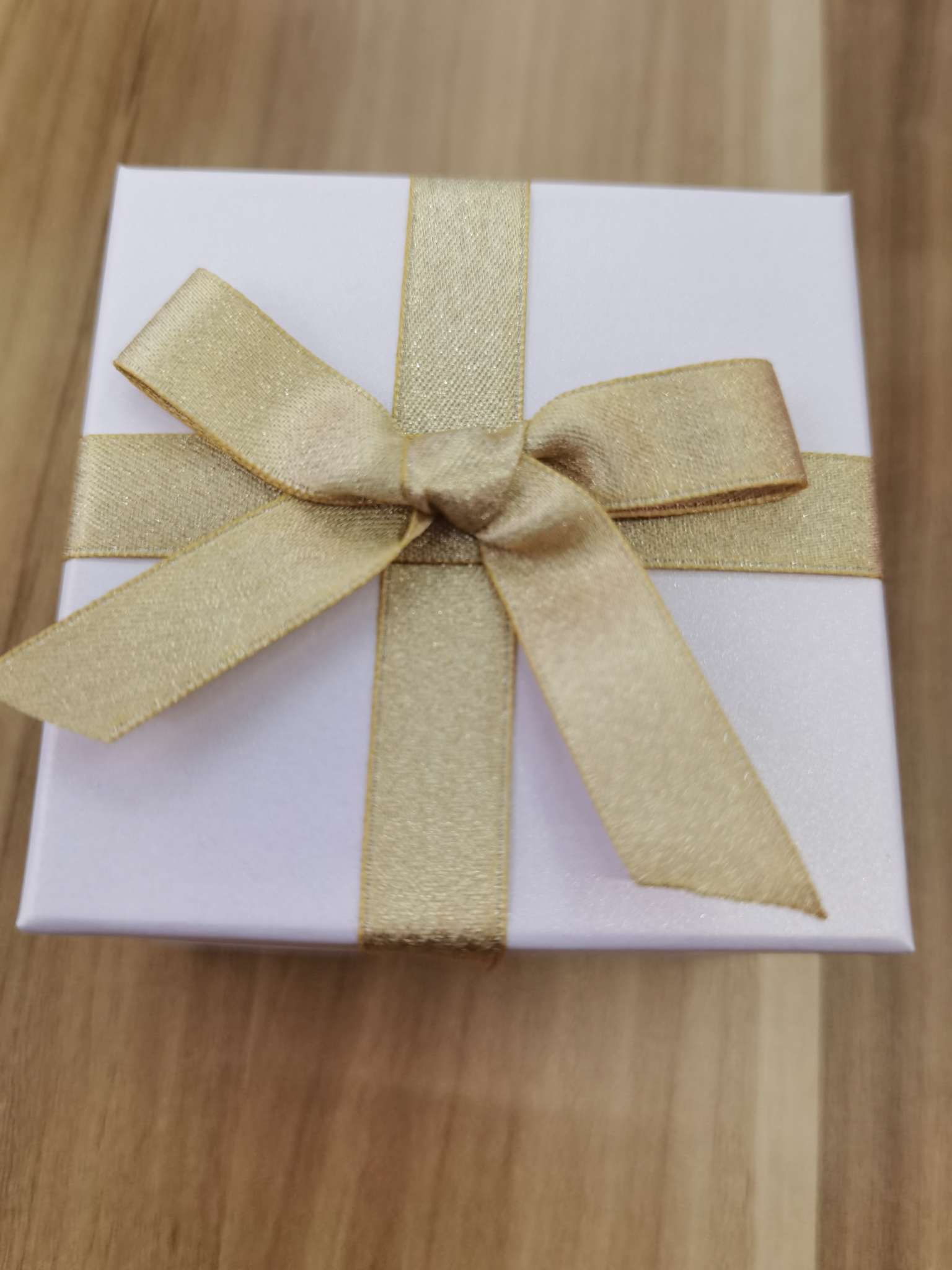 The gift box is small and white
