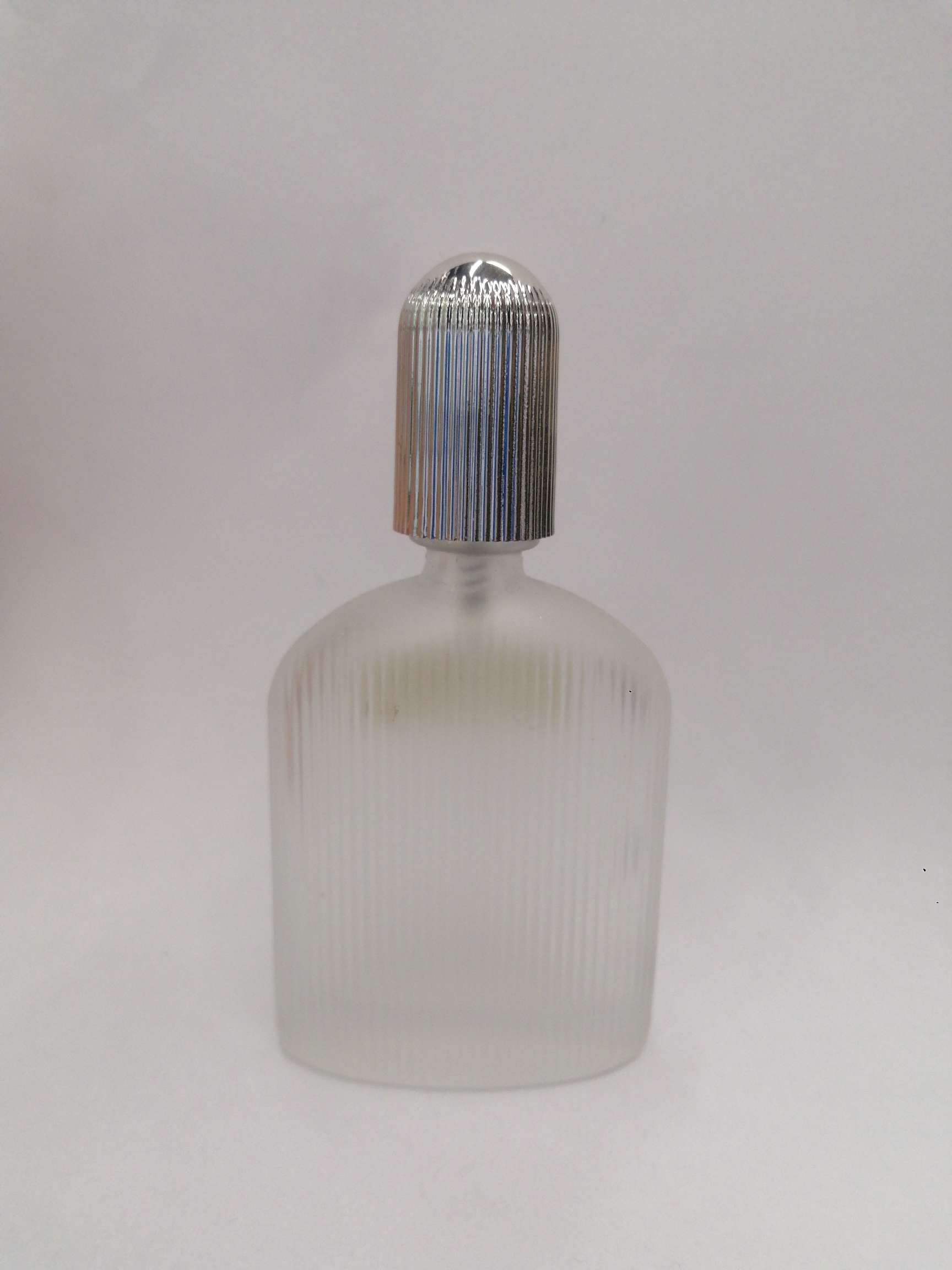 Clear glass corrugated perfume bottle
