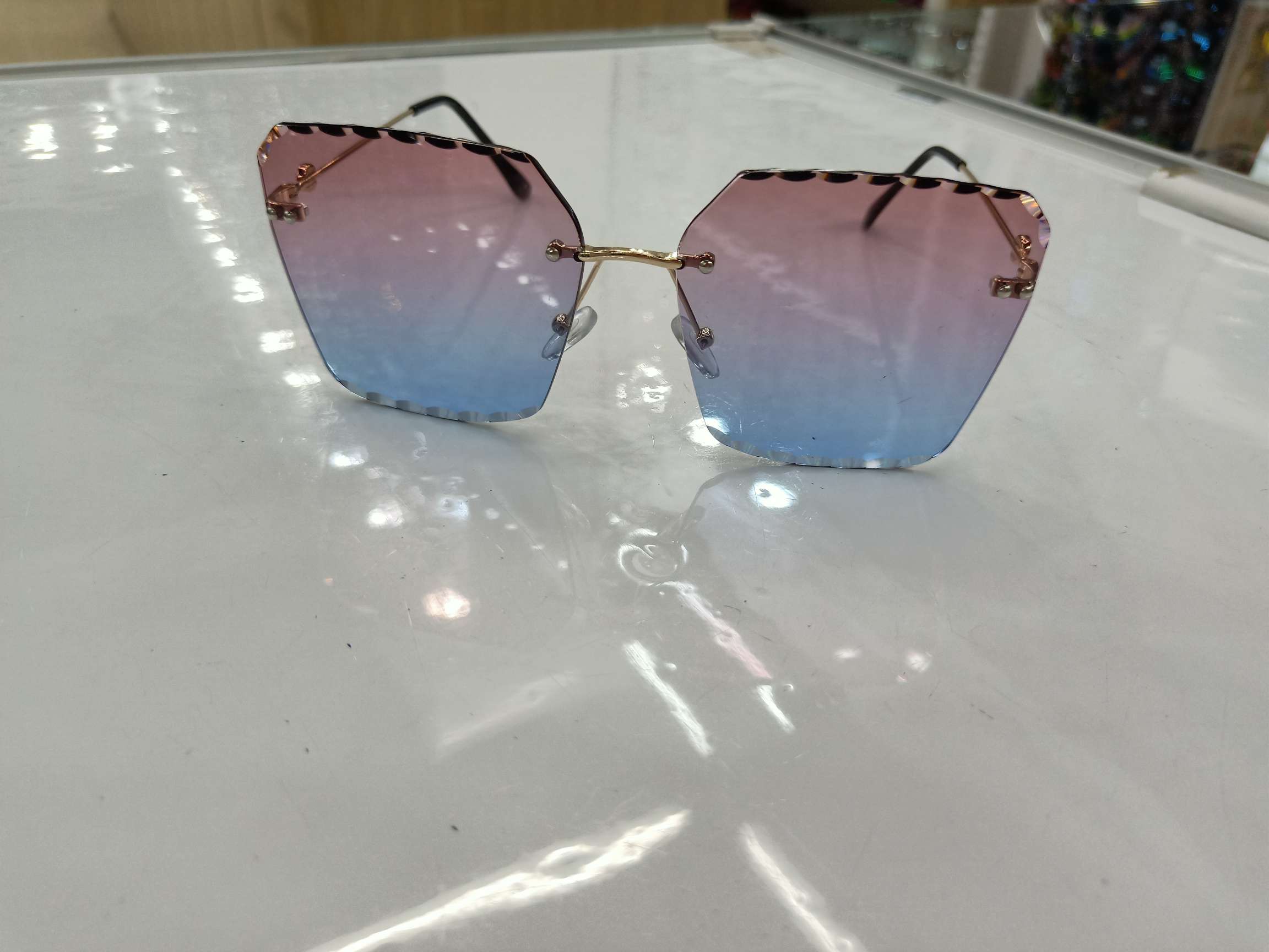 2020 new frameless European and American trimmed women's sunglasses, trendy big face, round face slimming glasses, UV protection sunglasses