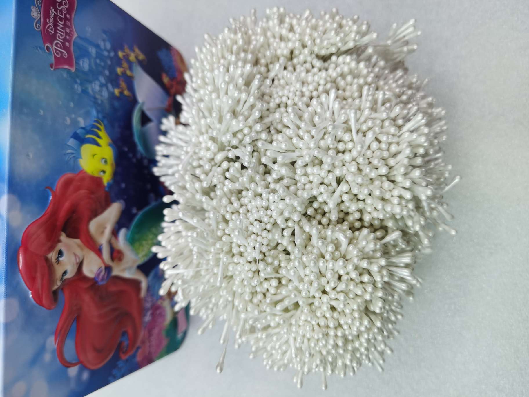 Hardened small pearlescent white