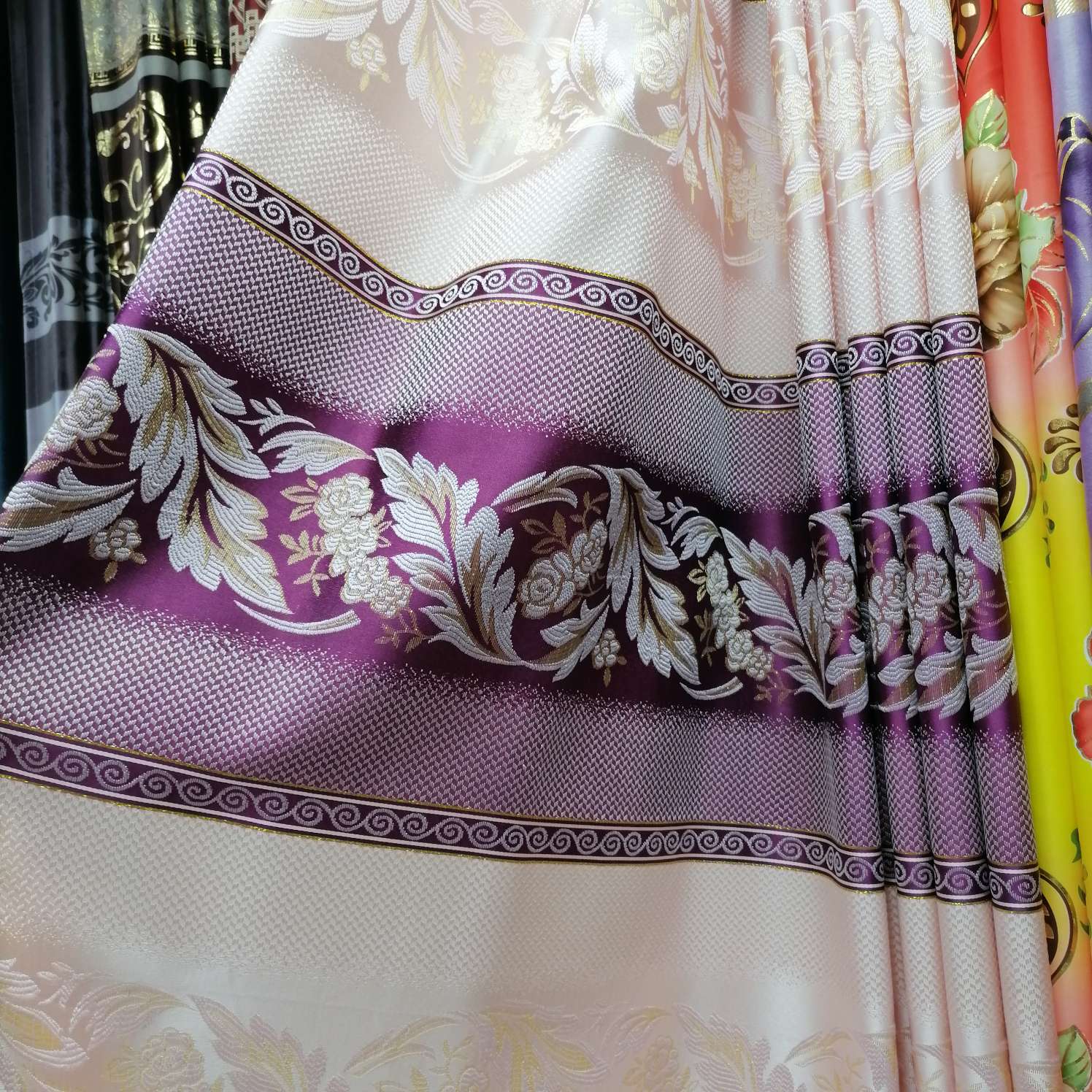 The curtain fabric has purple stripes