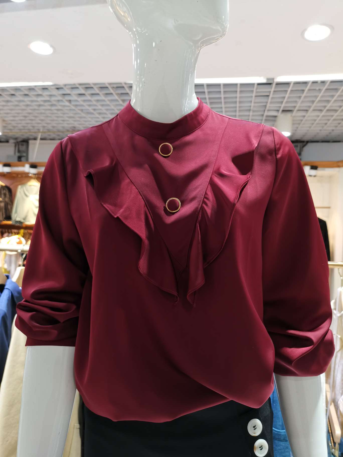 A bright purple-red standing round long-sleeved women's dress with a batwing collar