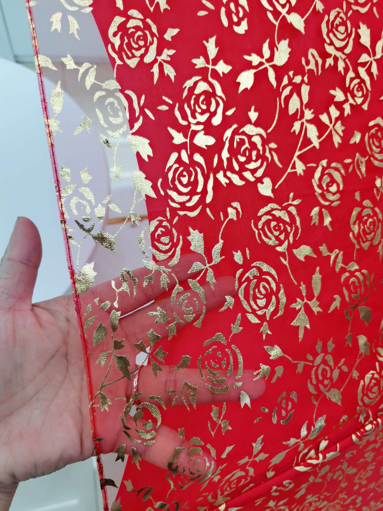 The bride's umbrella is a full sheet of gold-threaded embroidered wedding umbrella and a big red umbrella undefined