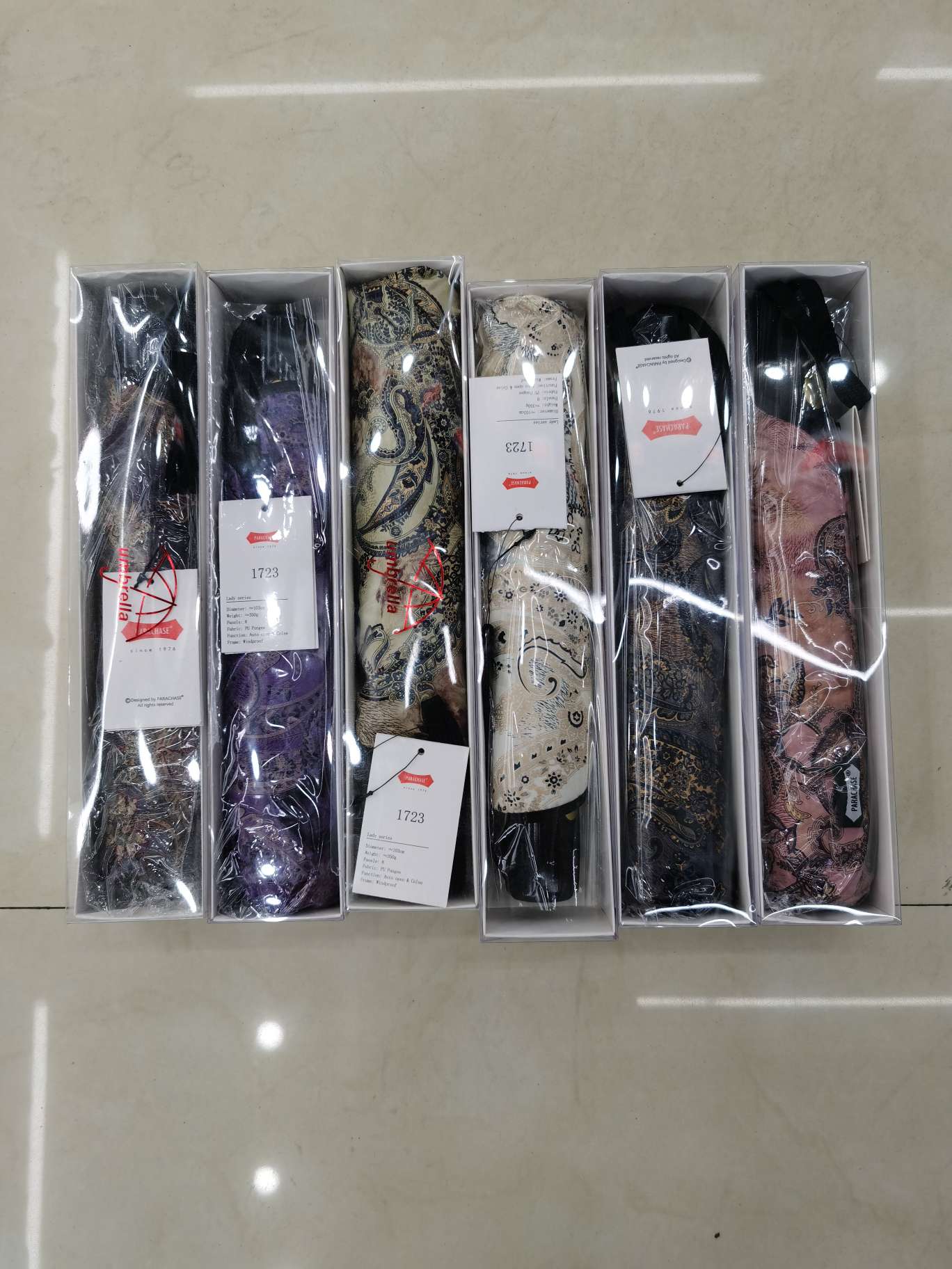 53.5x8K three-fold self-opening and closing peritoneal fabric gift box umbrella, item number 1723