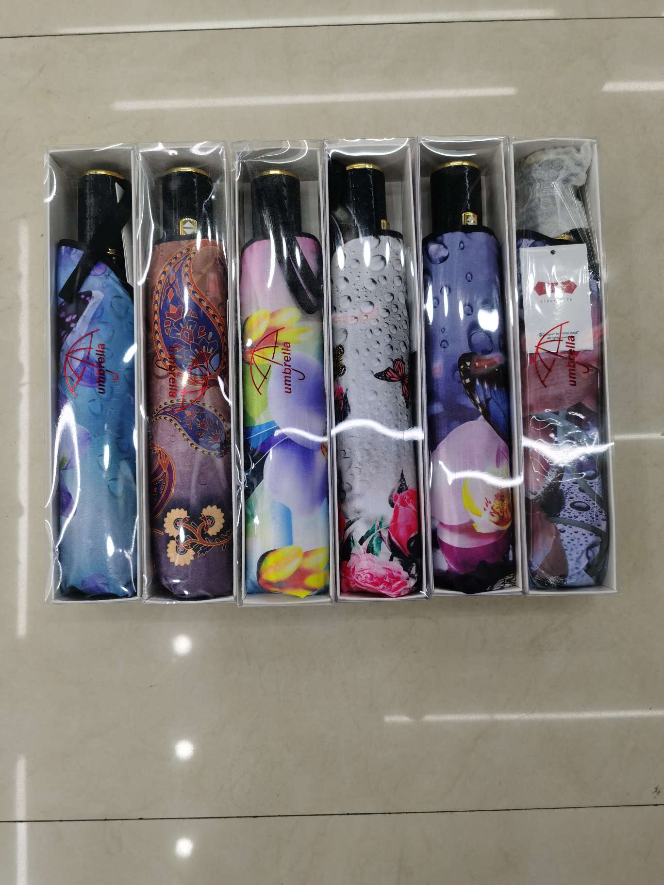 58.5x9k three-fold self-opening resin bone windproof colored fabric umbrella gift box, item number 1721