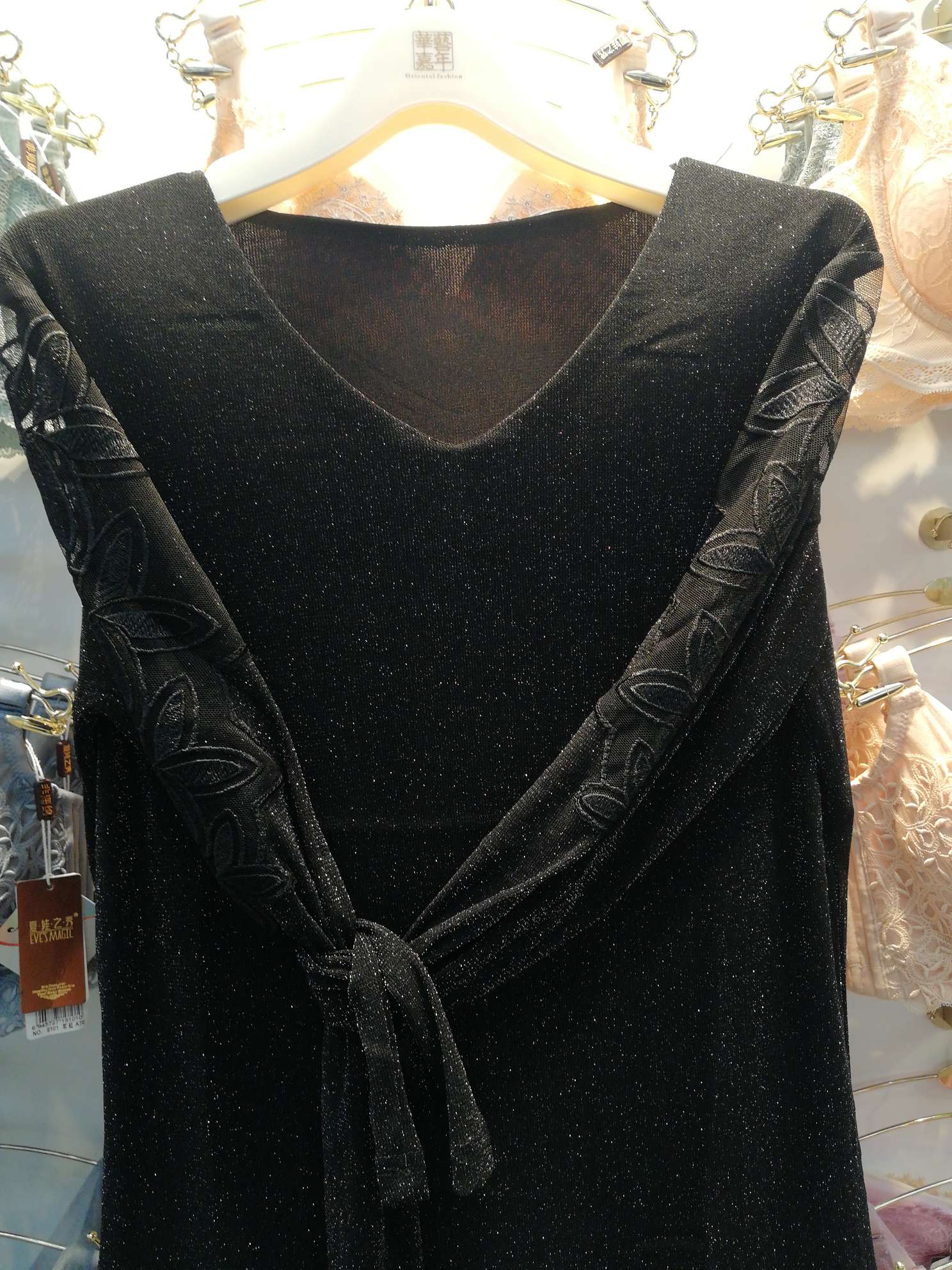 A black heart-neck base layer with lace sleeves