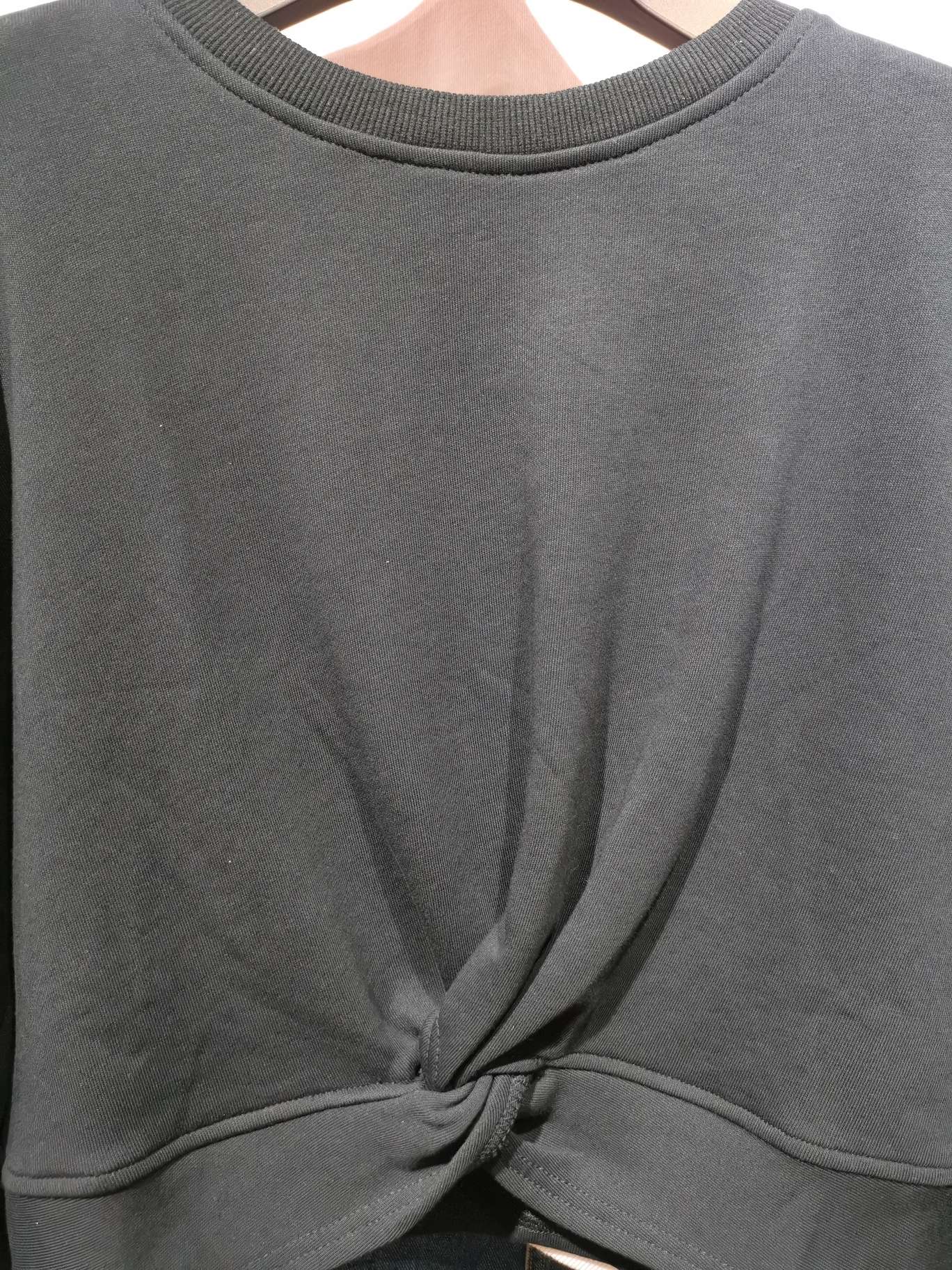 All-black cotton fashionable women's top with a waist knot