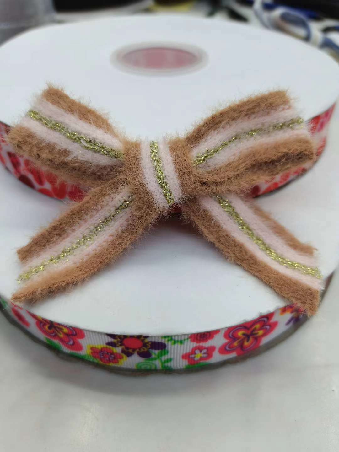 A mink woven ribbon bow undefined