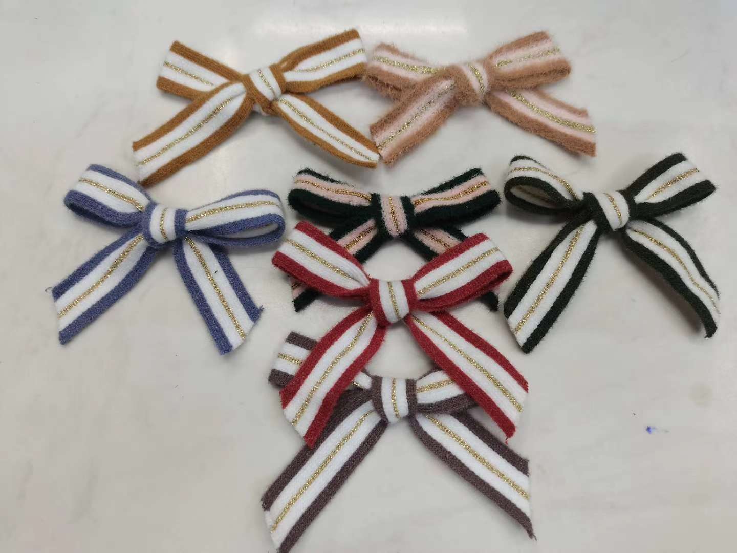 A mink woven ribbon bow undefined