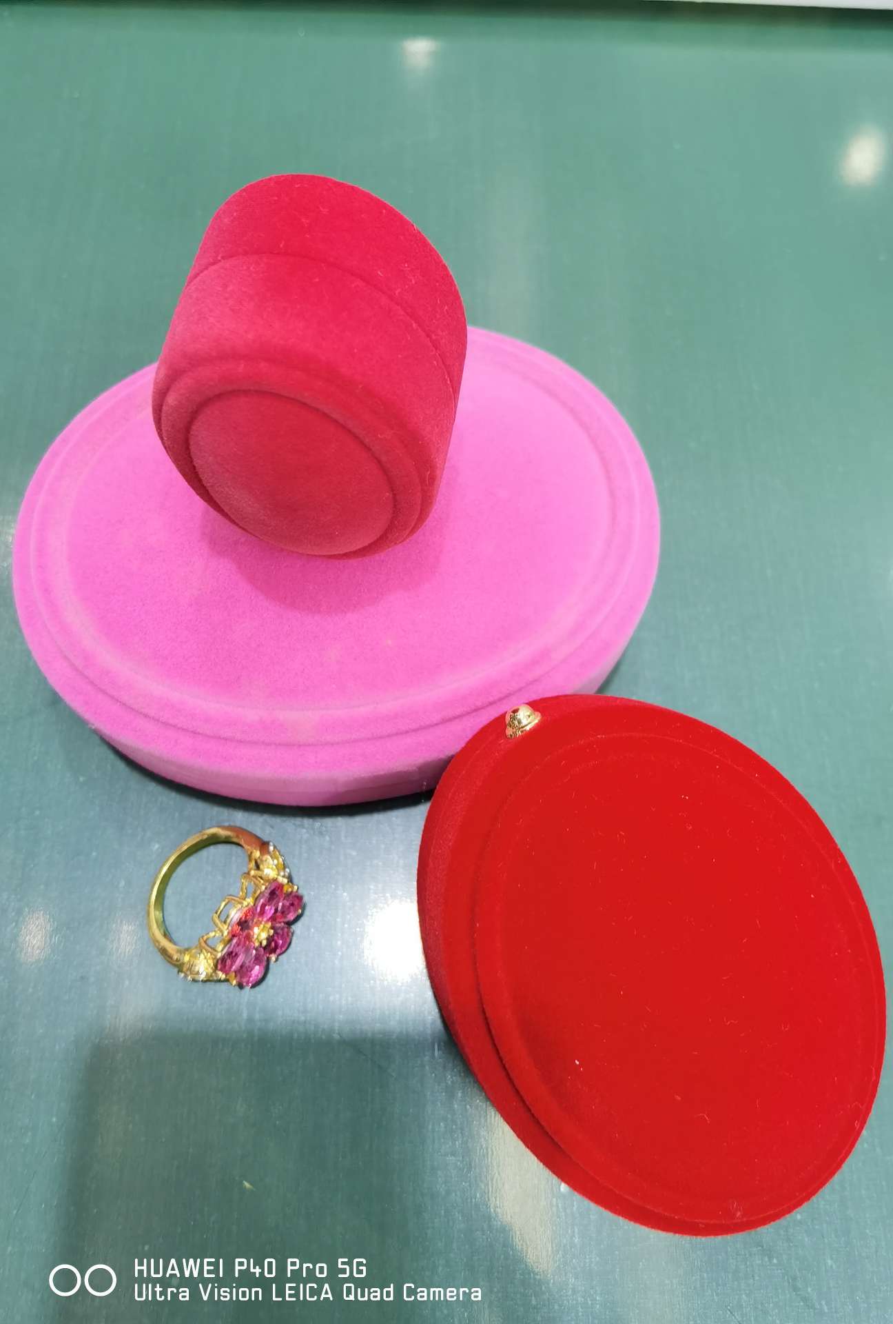 A set of circular boxes, rings, pendants, bracelets, necklaces and suits details Picture