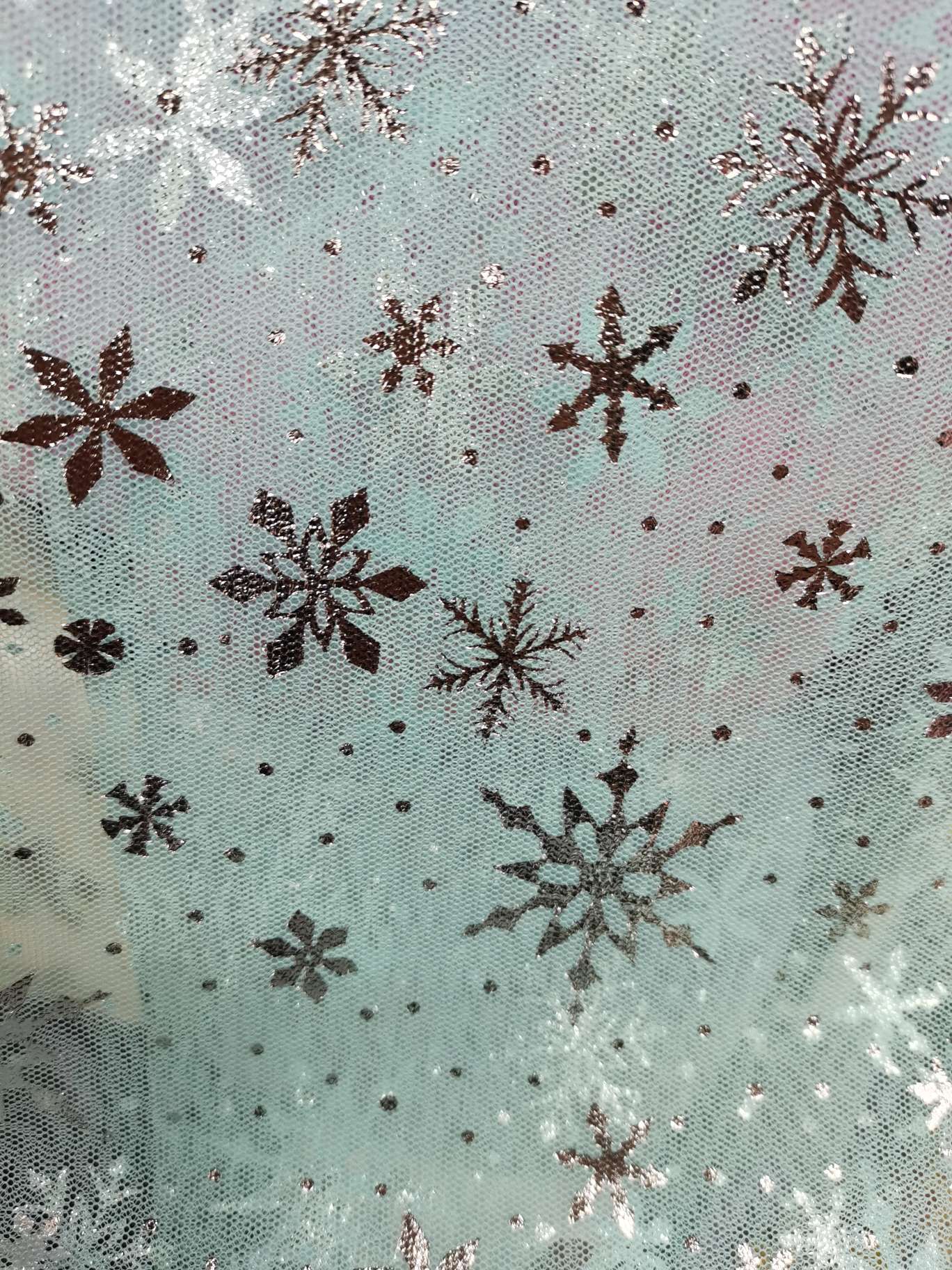 Silver snowflakes are used as fabrics for clothing accessories