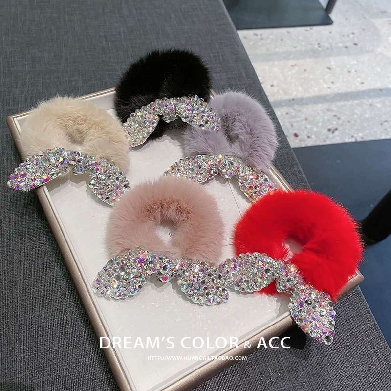 The butterfly flower jewelry features fur bands, leather ears and is adorned with numerous diamonds