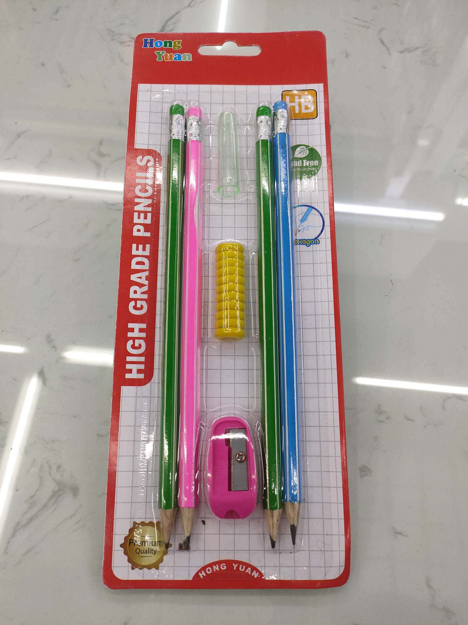 Four pencils + pencil cases + pencil sharpeners