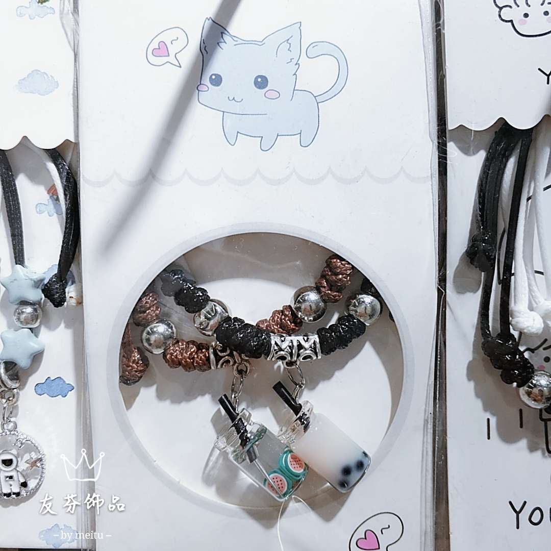 Pair of fruit bottles with leather string bracelet thumbnail