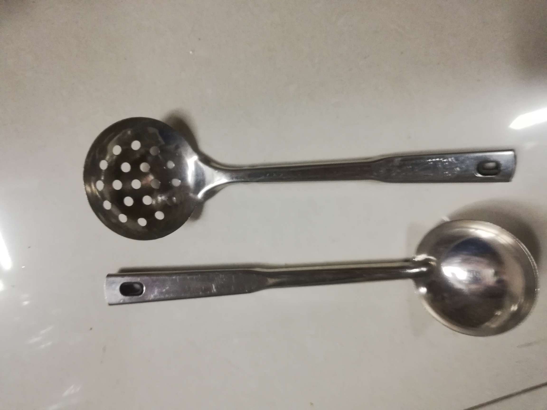 Long-handled iron spoon