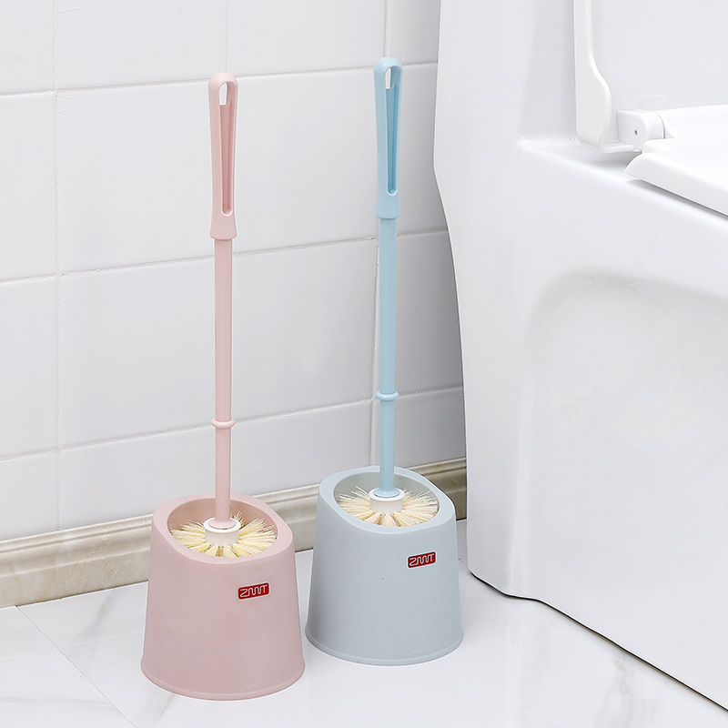 A set of long-handled wall-mounted stainless steel soft-bristled brushes with a base for cleaning hard-to-reach bathrooms, scrubbing toilets, and cleaning toilets