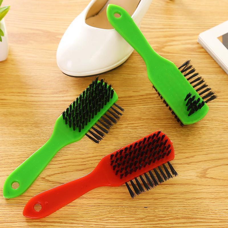 Several plastic shoe polish brushes, plastic handles, household shoe upper cleaning brushes, and shoe polish tools undefined