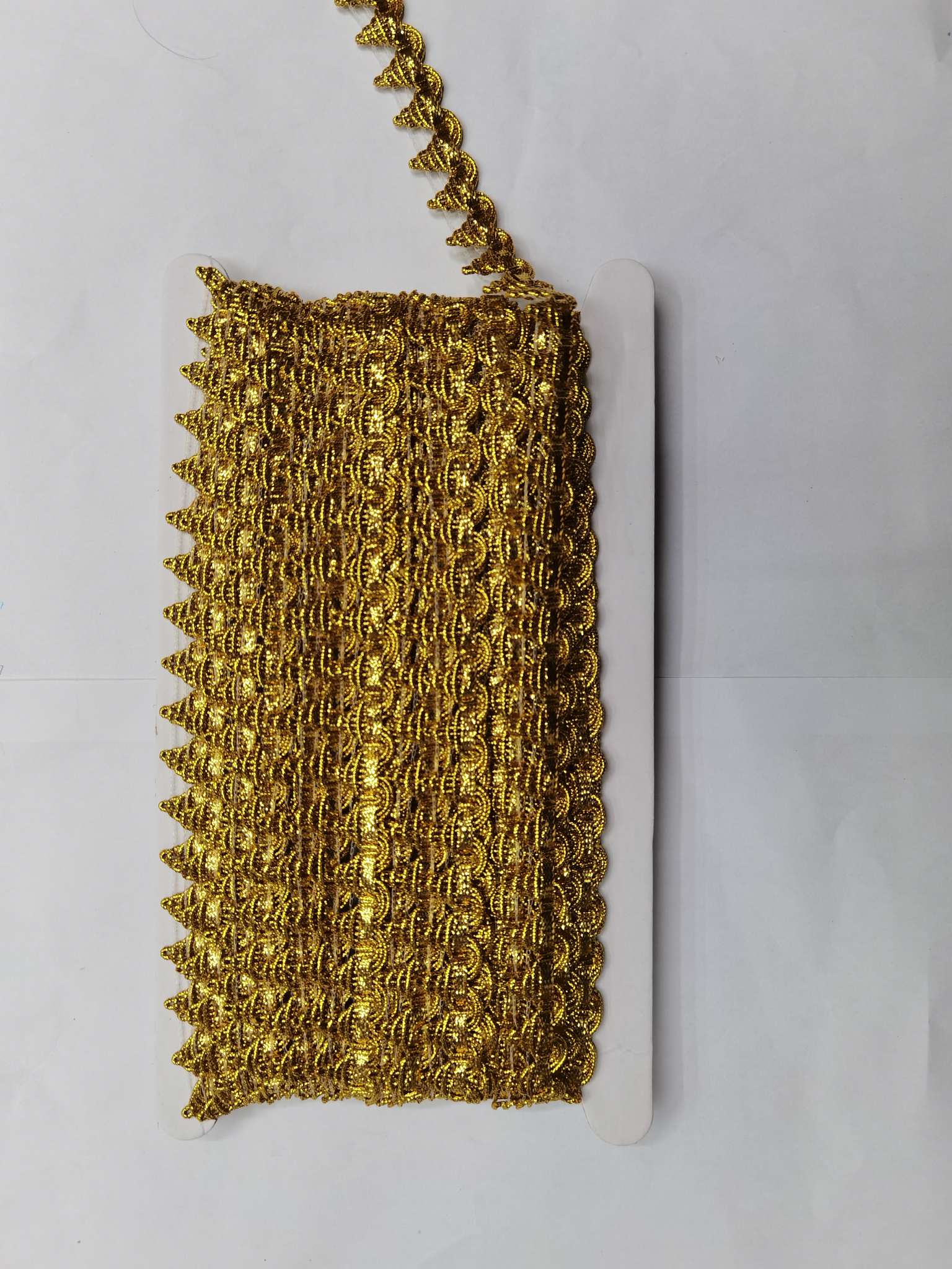 The small pyramid has multicolored lace detail image 4