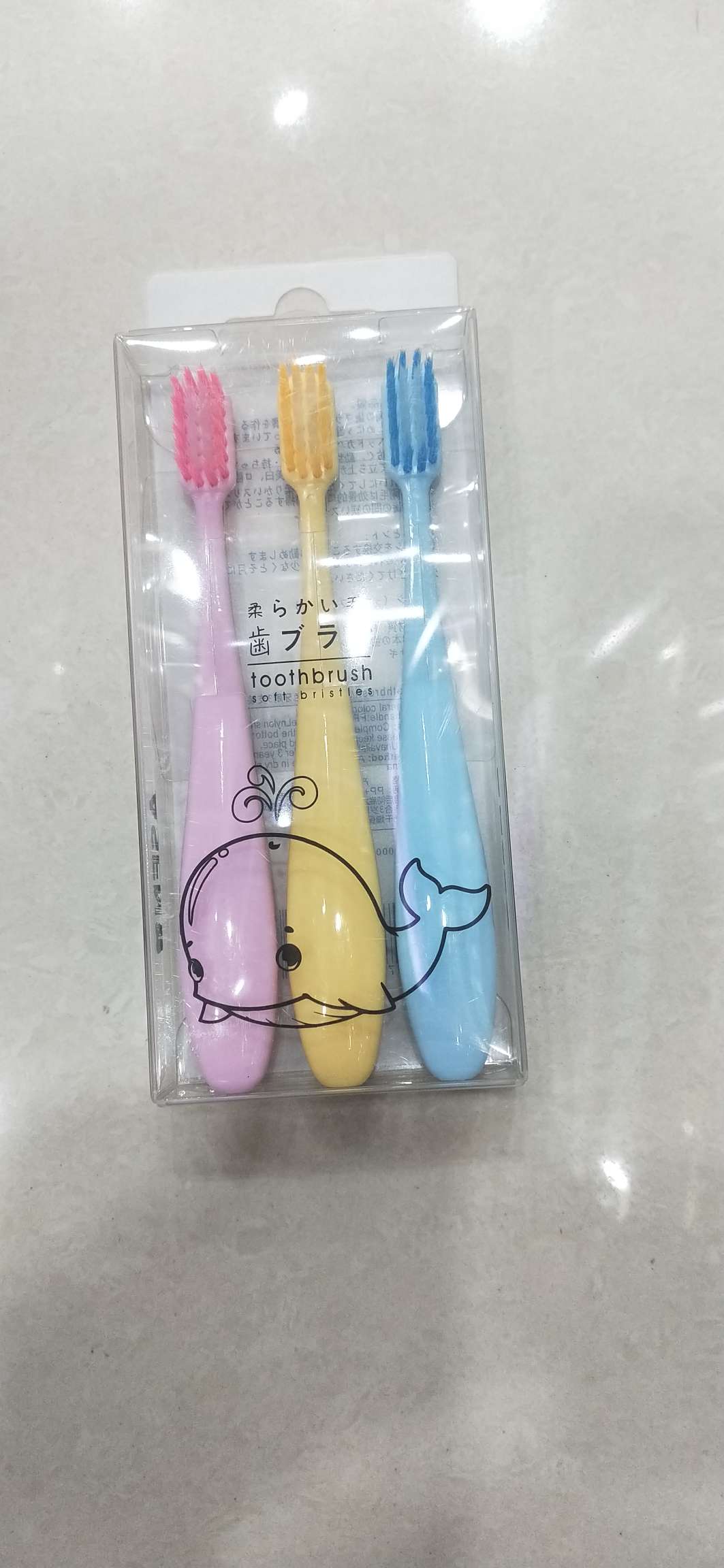 Three children's toothbrushes
