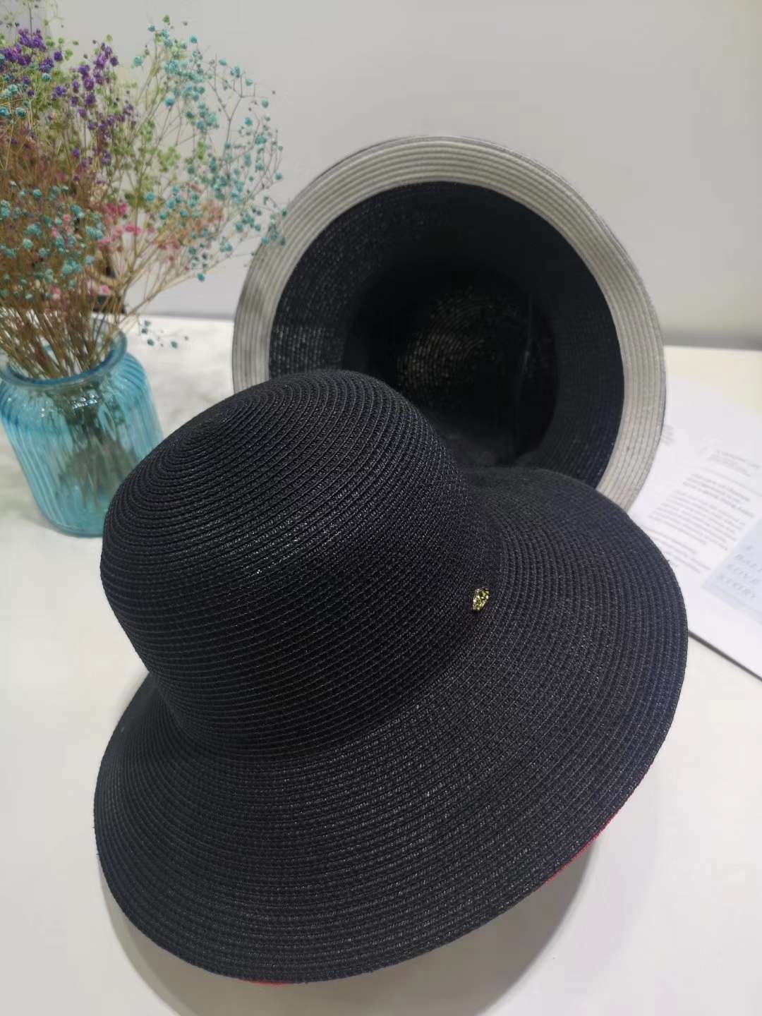 Close-Up of Basin Hat Showing Textured Fabric and Interior Lining Detail