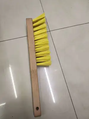 The wooden handle keeps out the dust brush thumbnail