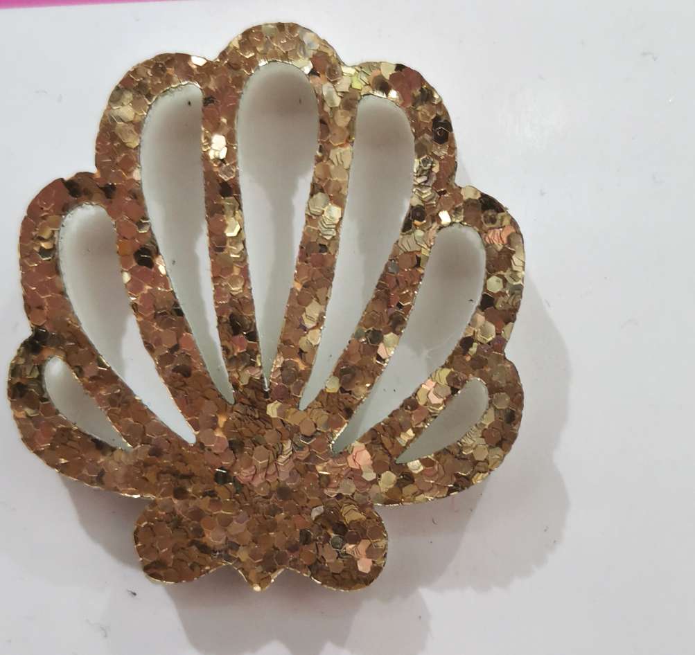 Slices of coarse powder sequined shells Specification image