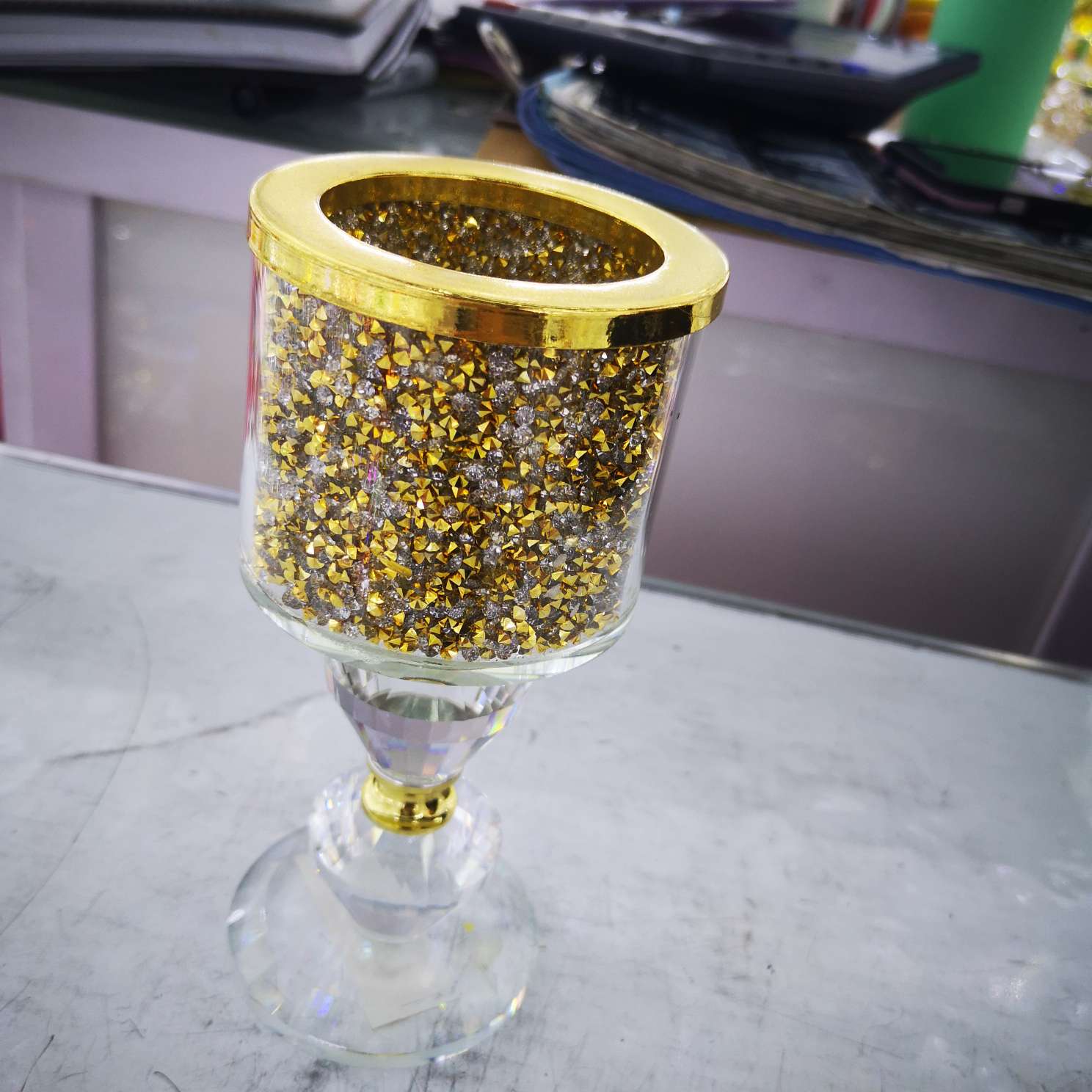 A golden candlestick with diamonds