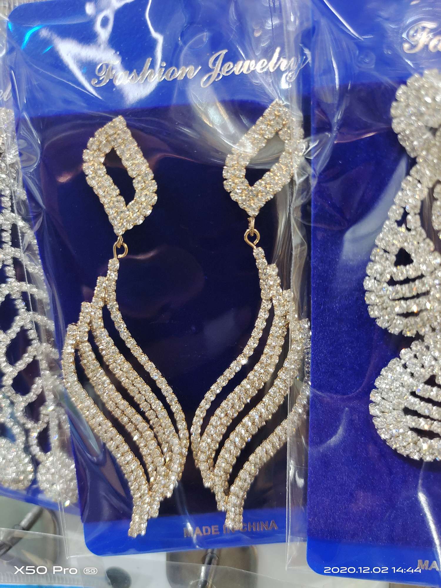 S-shaped rhinestone earrings