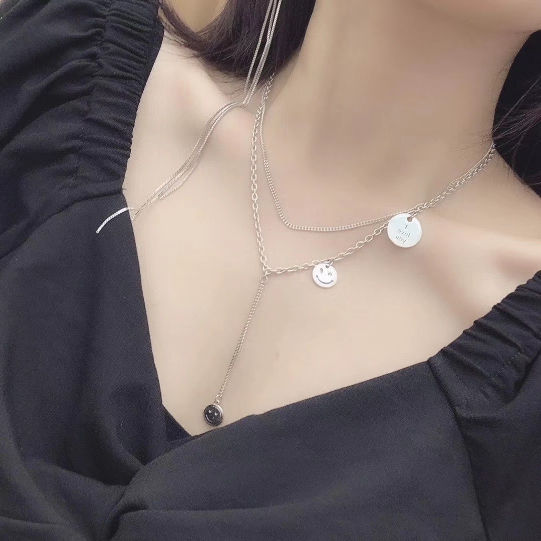 UKI SILVER and Ji S925 sterling silver smiley Face necklace