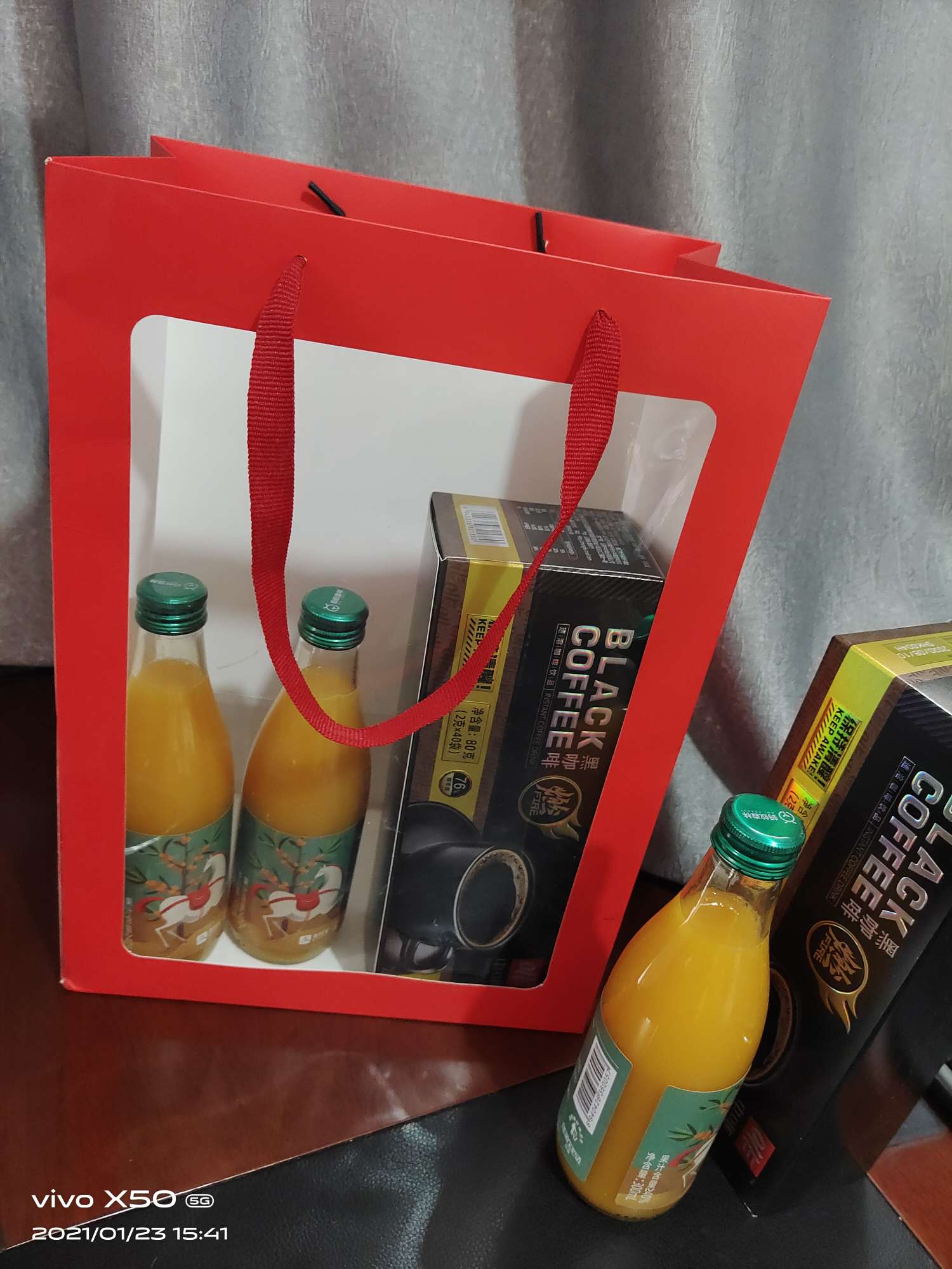 A bright red windowed gift bag details Picture