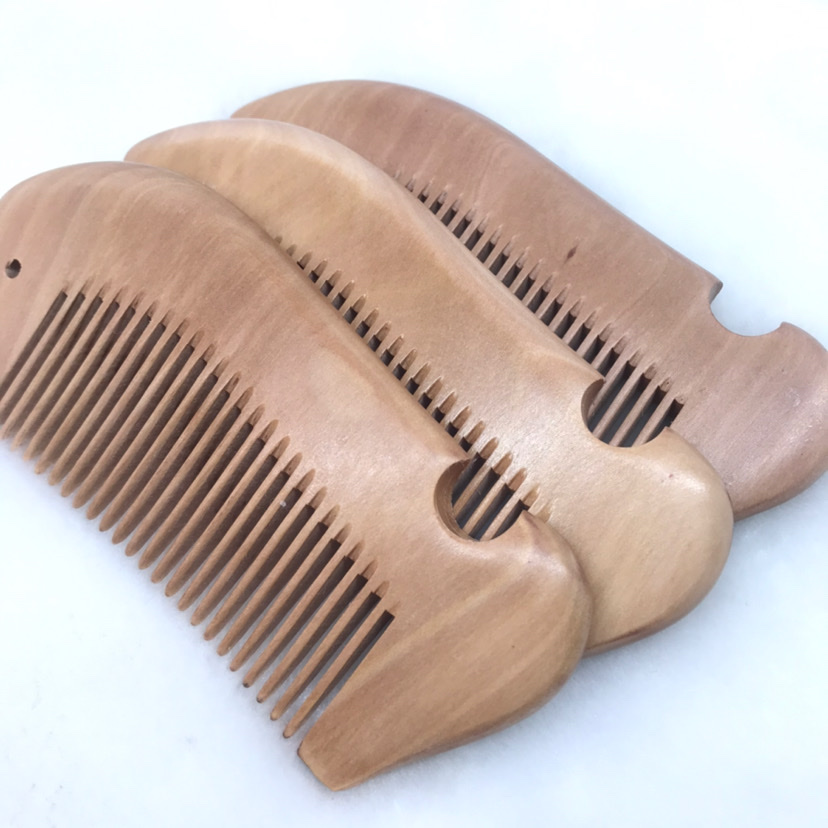 Factory direct sales of genuine natural wood nanmu fish-shaped combs, small hair combs, anti-static hair straightening combs detail image 9