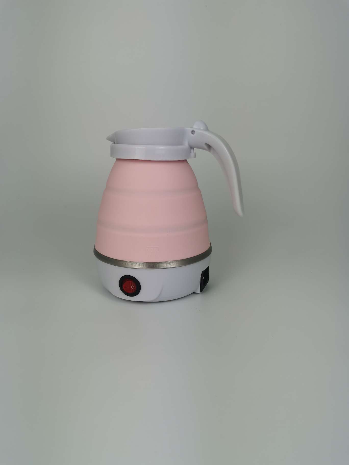 Folding kettle boiling water in hotel room