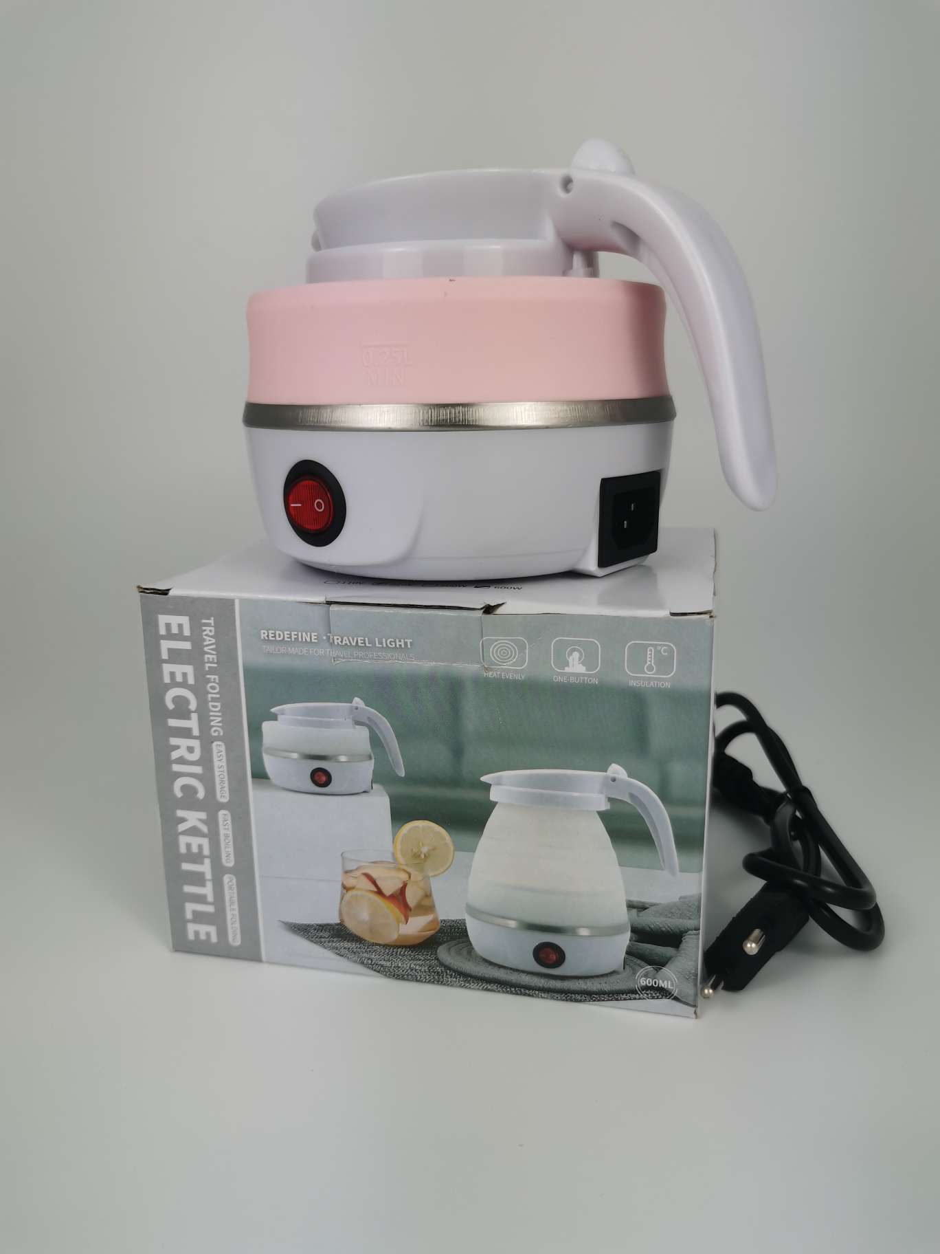 Traveler using folding kettle outdoors