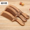 Factory direct sales of genuine, double-sided carved peach wood combs with large-sized handles Application Scenario
