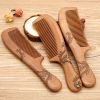 Factory direct sales of genuine, double-sided carved peach wood combs with large-sized handles Item Picture