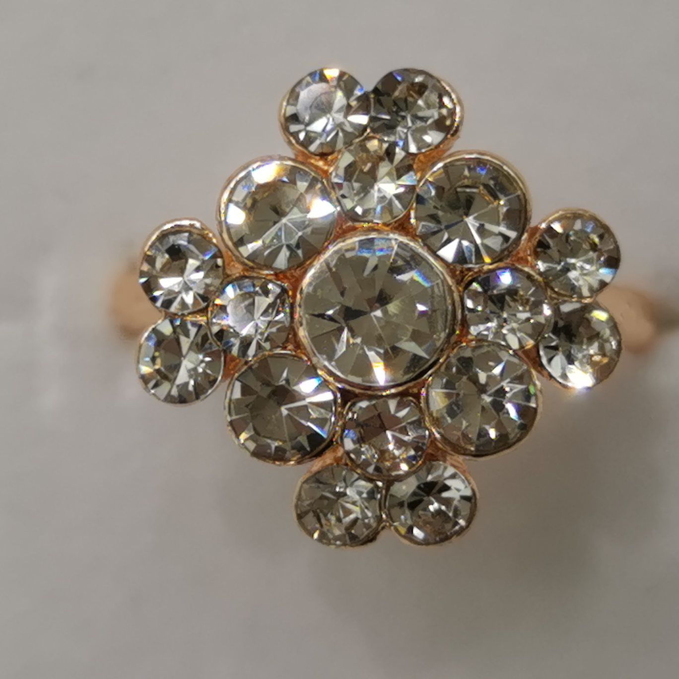 Open white rhinestones and gold rings