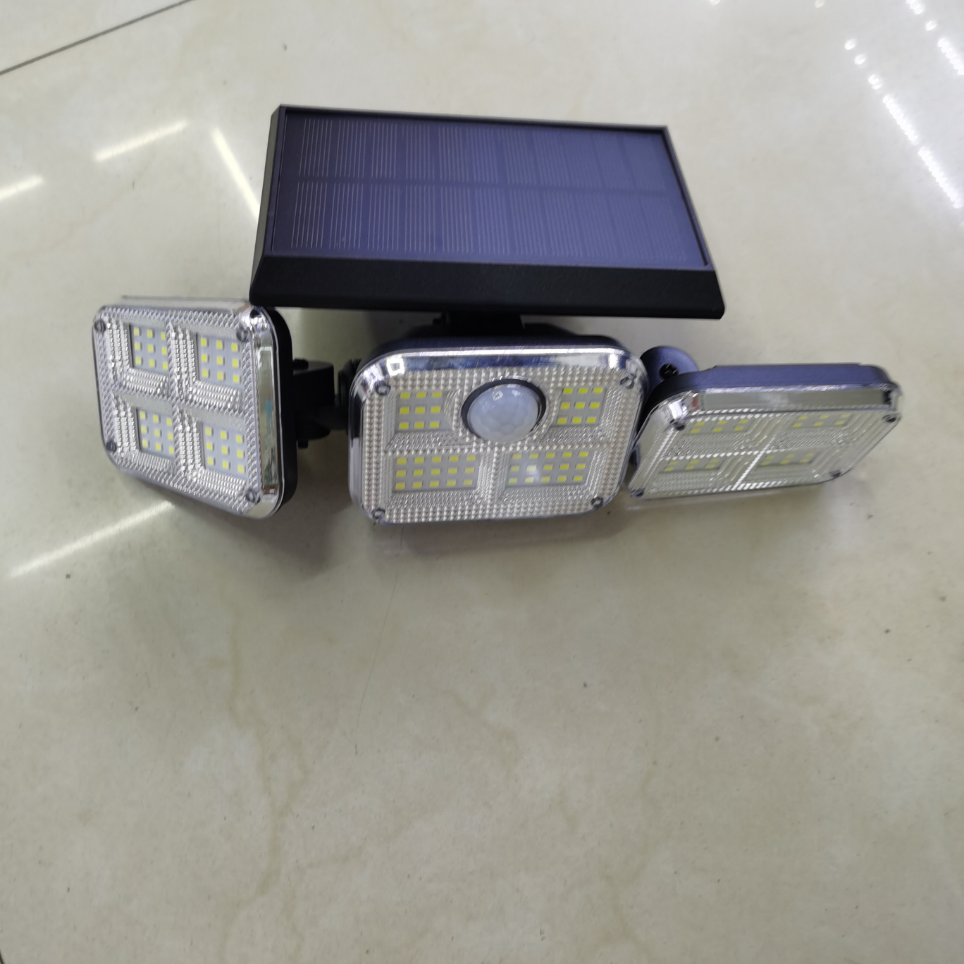 Solar sensor hanging lamp, solar 74LED three-head wall lamp, human body sensor double-head rotatable, household courtyard outdoor waterproof street lamp