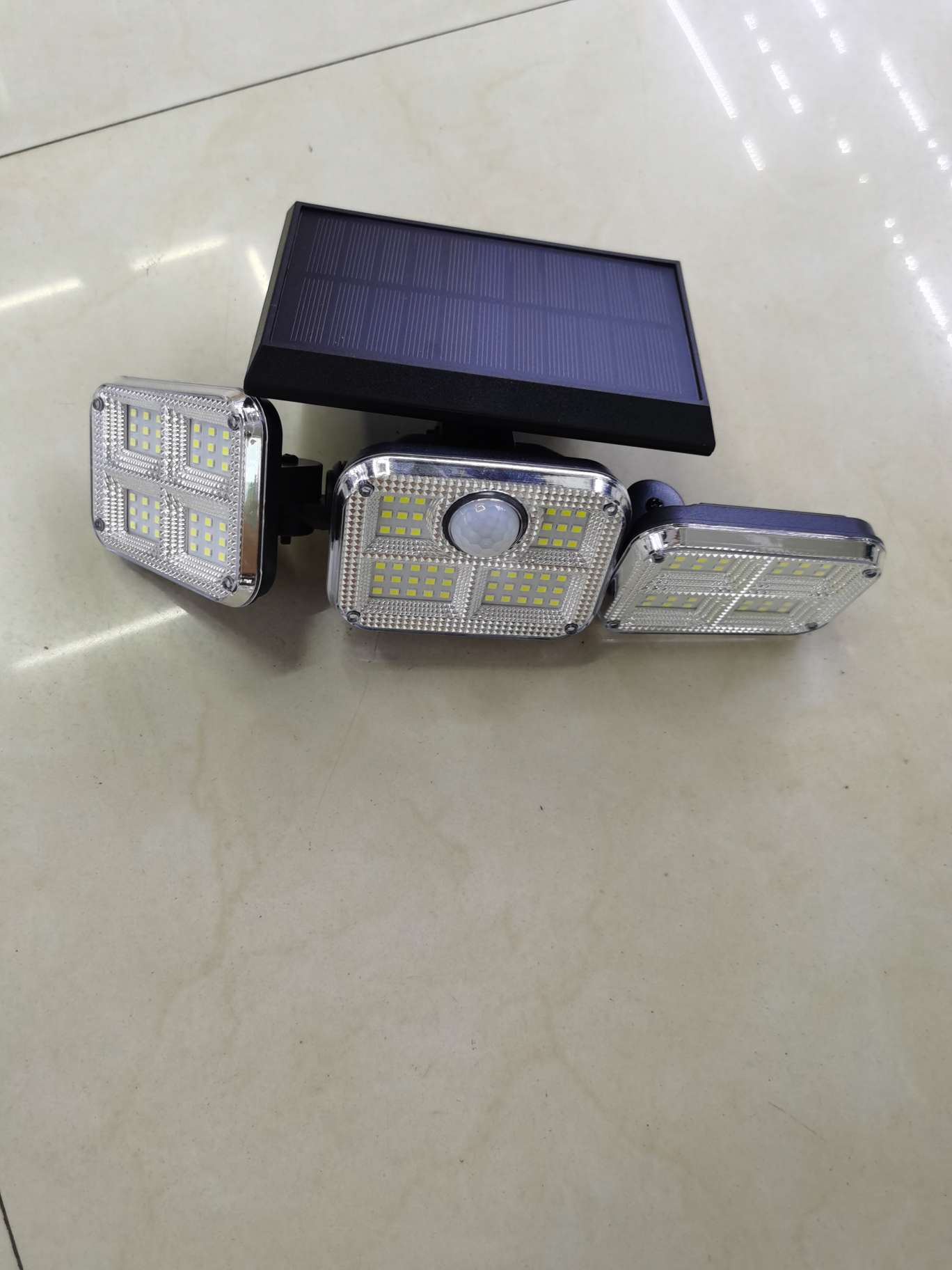 Solar sensor hanging lamp, solar 74LED three-head wall lamp, human body sensor double-head rotatable, household courtyard outdoor waterproof street lamp Application Scenario