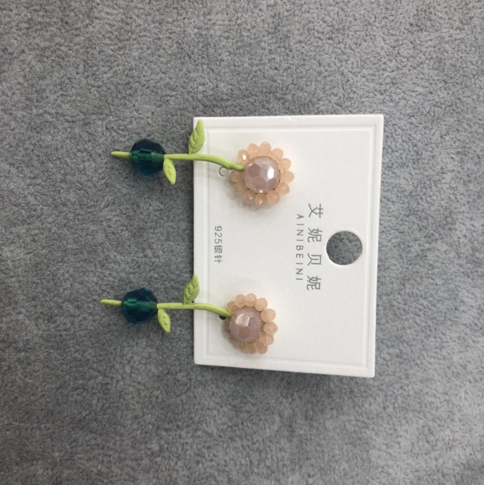 Dynamic handcrafted flower ear studs